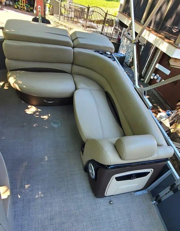Slide: The Image of Luxurious seating on 2017 Regency 220 DL3 pontoon boat, featuring beige upholstery. - 41