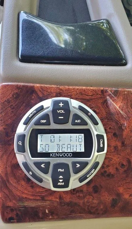 Slide: The Image of Kenwood audio control panel in 2017 Regency 220 DL3 boat dashboard. - 44