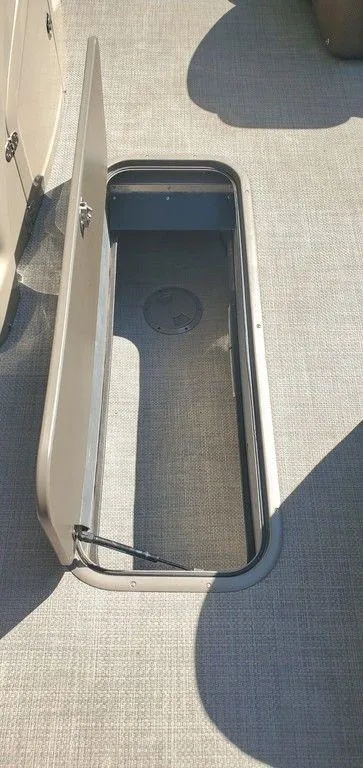 Slide: The Image of Open storage compartment on 2017 Regency 220 DL3 boat deck. - 6