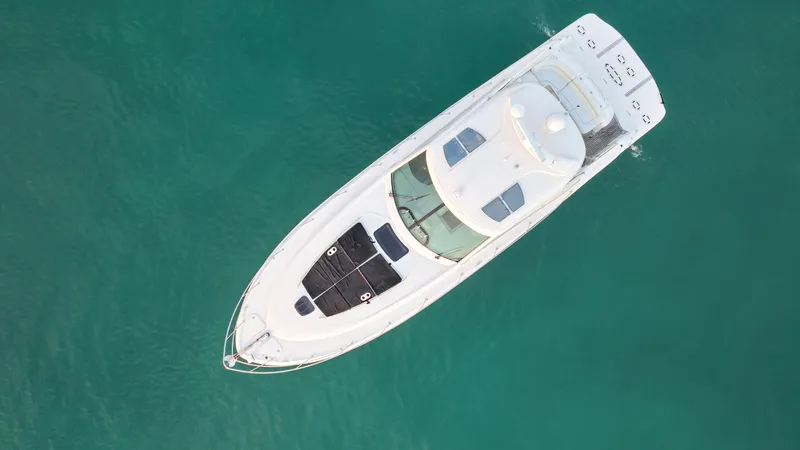 Slide: The Image of Aerial view of 2008 Sea Ray 48 Sundancer yacht on turquoise water. - 11