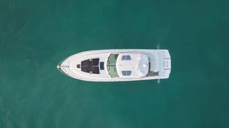 Slide: The Image of Aerial view of 2008 Sea Ray 48 Sundancer yacht on turquoise water. - 12
