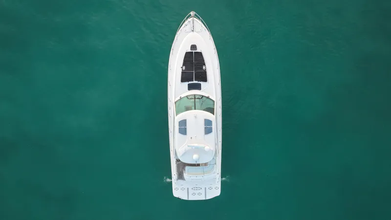 Slide: The Image of Overhead view of 2008 Sea Ray 48 Sundancer yacht on clear turquoise water. - 13