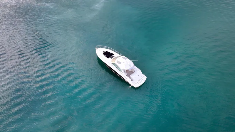 Slide: The Image of Aerial view of 2008 Sea Ray 48 Sundancer yacht on turquoise water. - 14