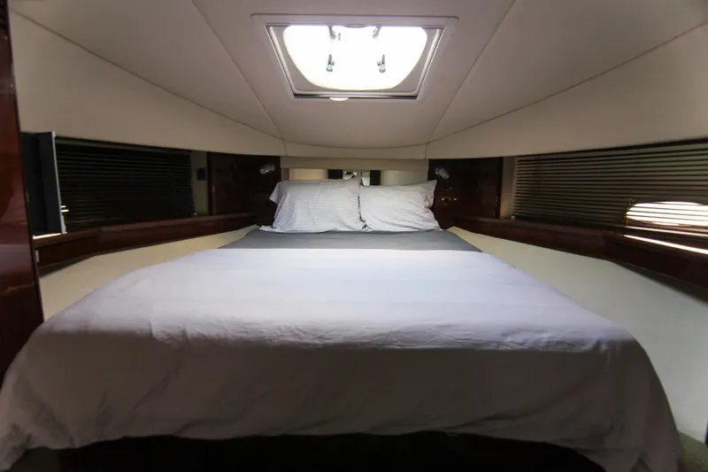 Slide: The Image of Interior cabin of 2008 Sea Ray 48 Sundancer with bed and skylight. - 22