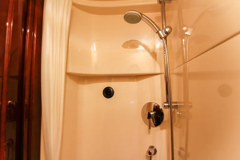 Slide: The Image of Shower area in 2008 Sea Ray 48 Sundancer yacht, featuring modern fixtures and curtain. - 26