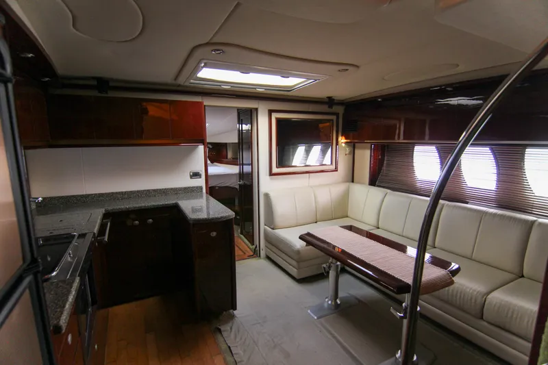 Slide: The Image of Luxurious interior of 2008 Sea Ray 48 Sundancer yacht with modern kitchen and seating area. - 27