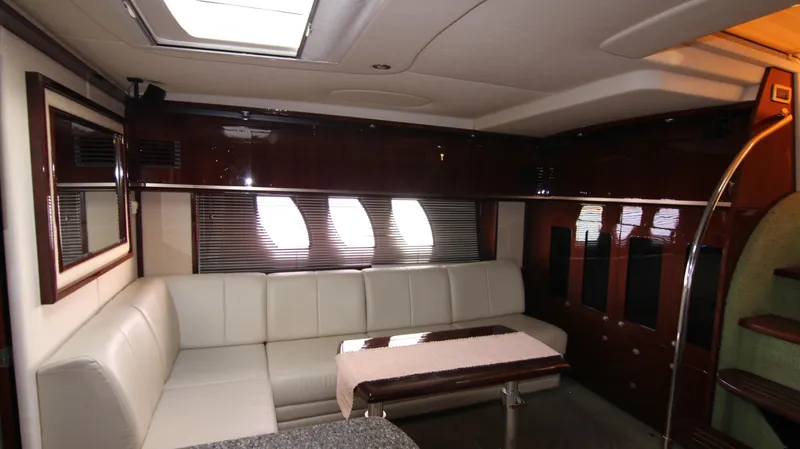 Slide: The Image of Luxurious interior of 2008 Sea Ray 48 Sundancer yacht with elegant seating and table. - 30
