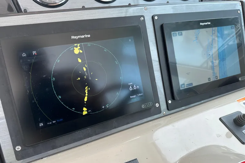 Slide: The Image of Raymarine navigation screens on 2008 Sea Ray 48 Sundancer boat dashboard. - 33