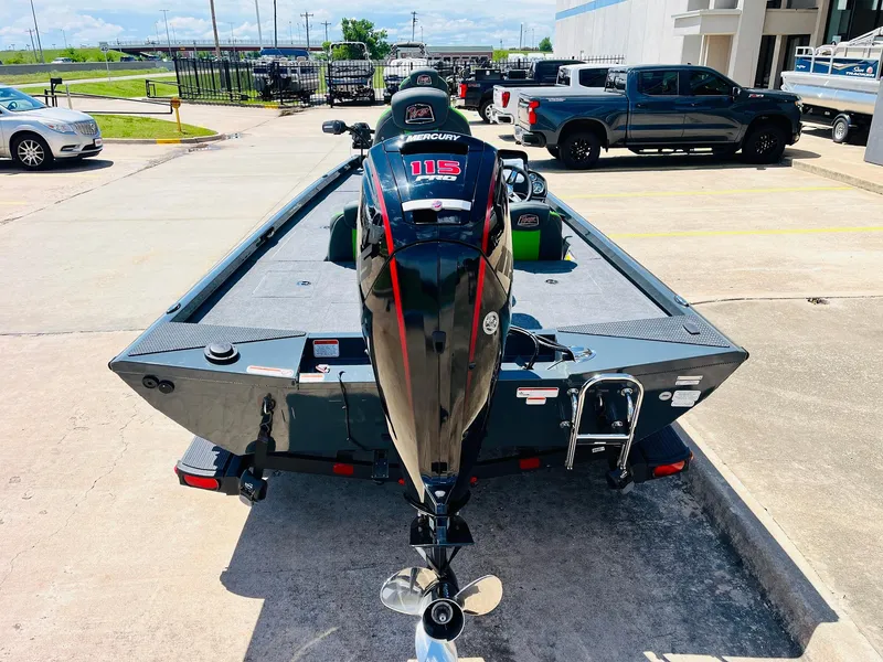 Slide: The Image of 2025 Ranger RT188C boat with Mercury engine, parked outdoors on a sunny day. - 10