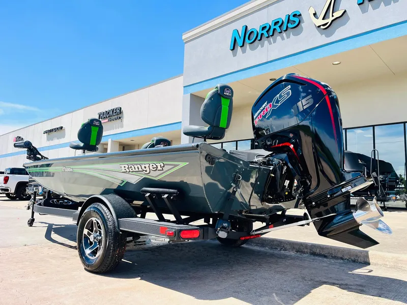 Slide: The Image of 2025 Ranger RT188C boat with powerful outboard motor, parked outside Norris dealership. - 11