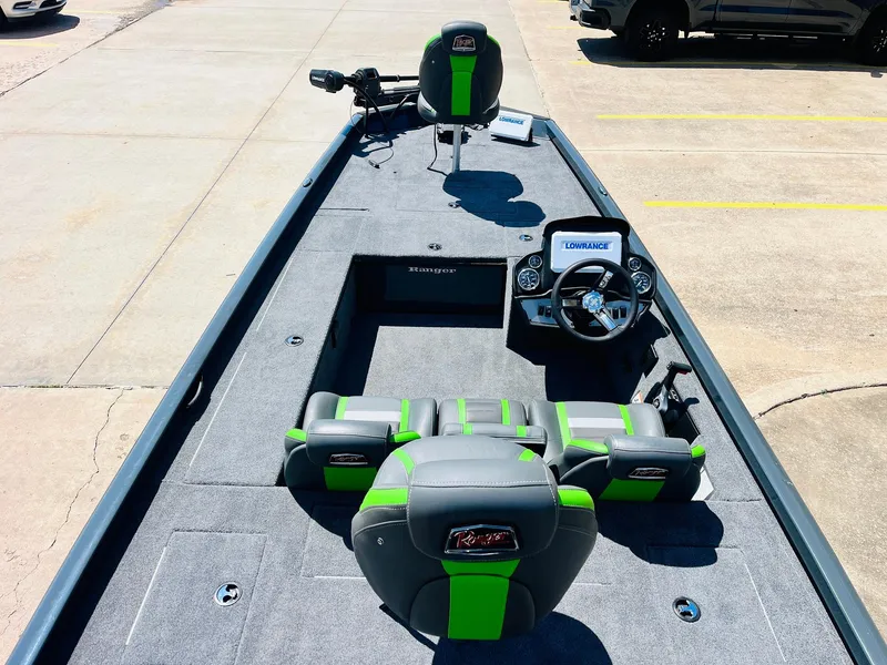 Slide: The Image of 2025 Ranger RT188C fishing boat with green accents, spacious deck, and modern controls. - 14