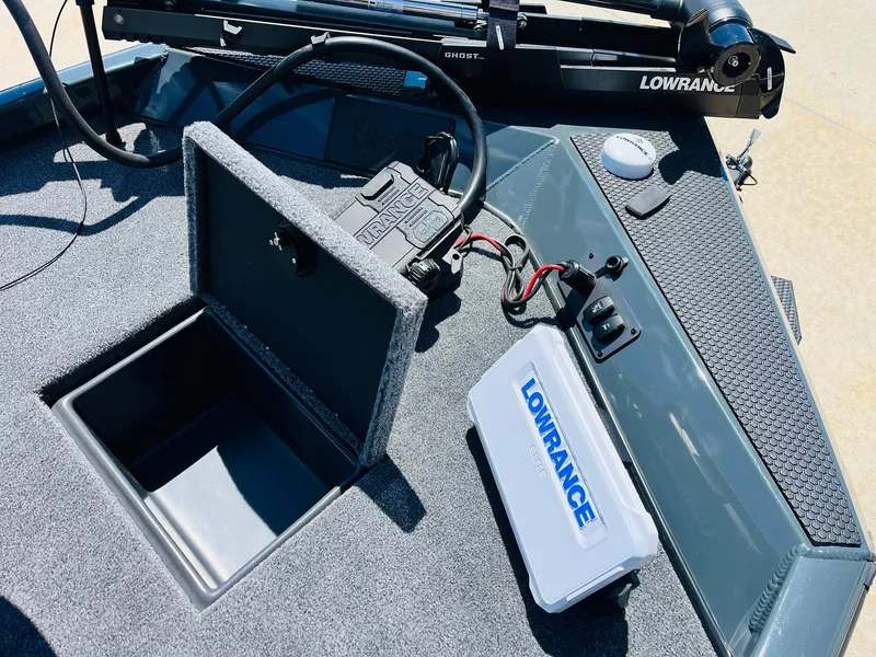 Slide: The Image of 2025 Ranger RT188C boat deck with Lowrance electronics and storage compartment. - 19