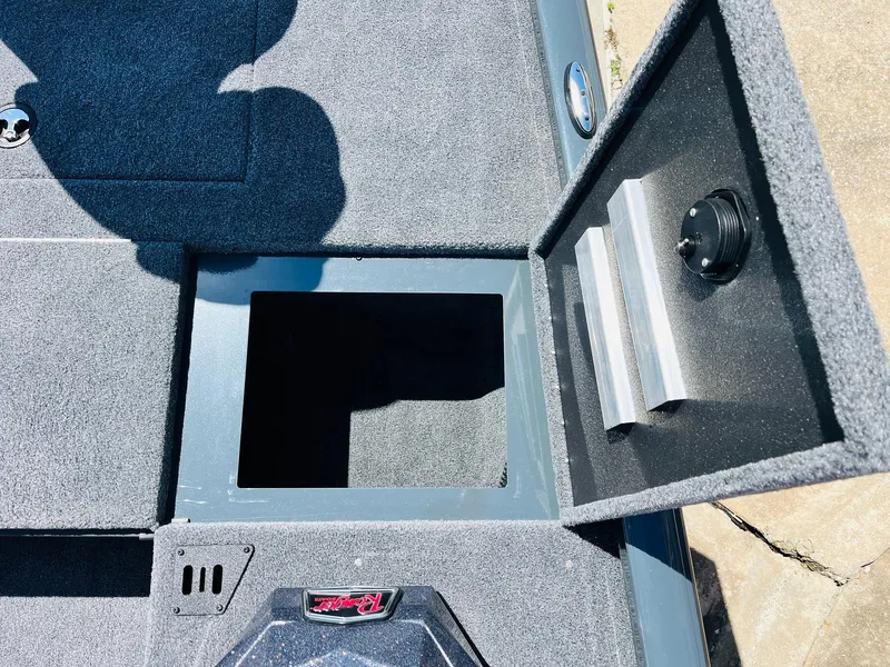 Slide: The Image of Open storage compartment on 2025 Ranger RT188C boat deck. - 27