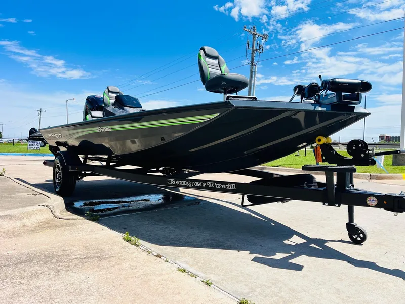 Slide: The Image of 2025 Ranger RT188C boat on trailer, sleek design, green accents, sunny day. - 4