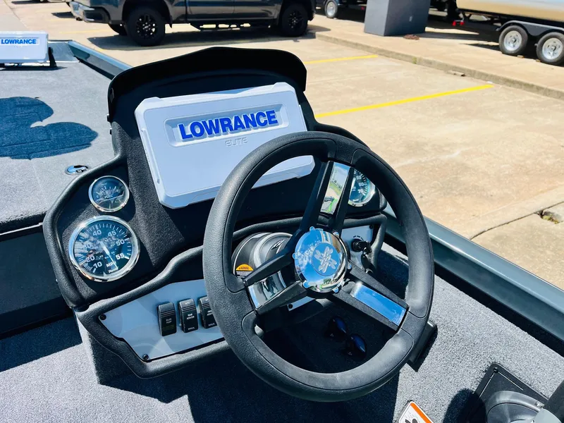 Slide: The Image of 2025 Ranger RT188C boat dashboard with Lowrance electronics and steering wheel. - 42