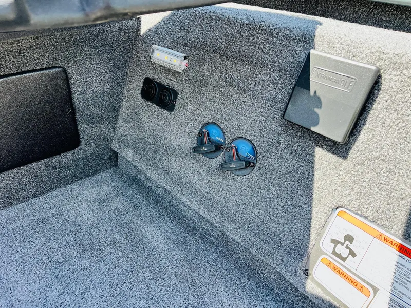 Slide: The Image of Interior of 2025 Ranger RT188C boat with control panel and warning labels. - 44