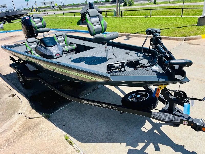 Slide: The Image of 2025 Ranger RT188C fishing boat on trailer, featuring modern design and seating. - 5