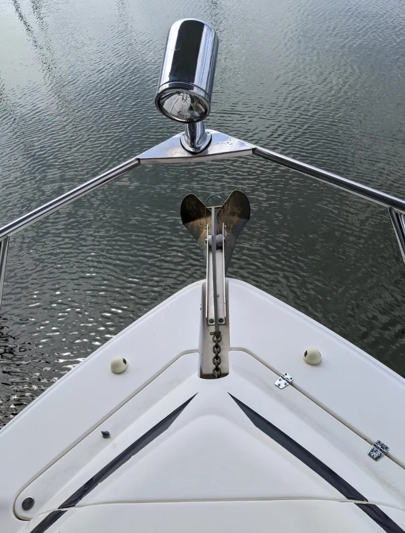 Slide: The Image of Bow of 2004 Rinker Fiesta Vee 410 boat with anchor and spotlight. - 47