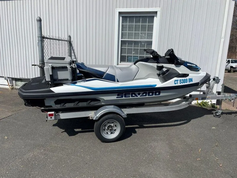Slide: The Image of 2021 Sea-Doo Fish Pro™ iDF with Sound System on trailer, parked outside a building. - 0