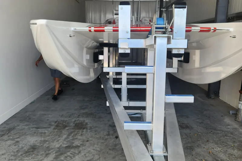 Slide: The Image of 2022 HellCat 32 Wide Body boat on trailer in storage facility. - 10