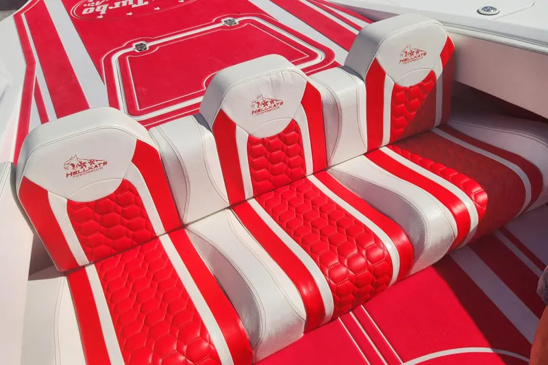 Slide: The Image of Red and white seating in 2022 HellCat 32 Wide Body boat. - 6