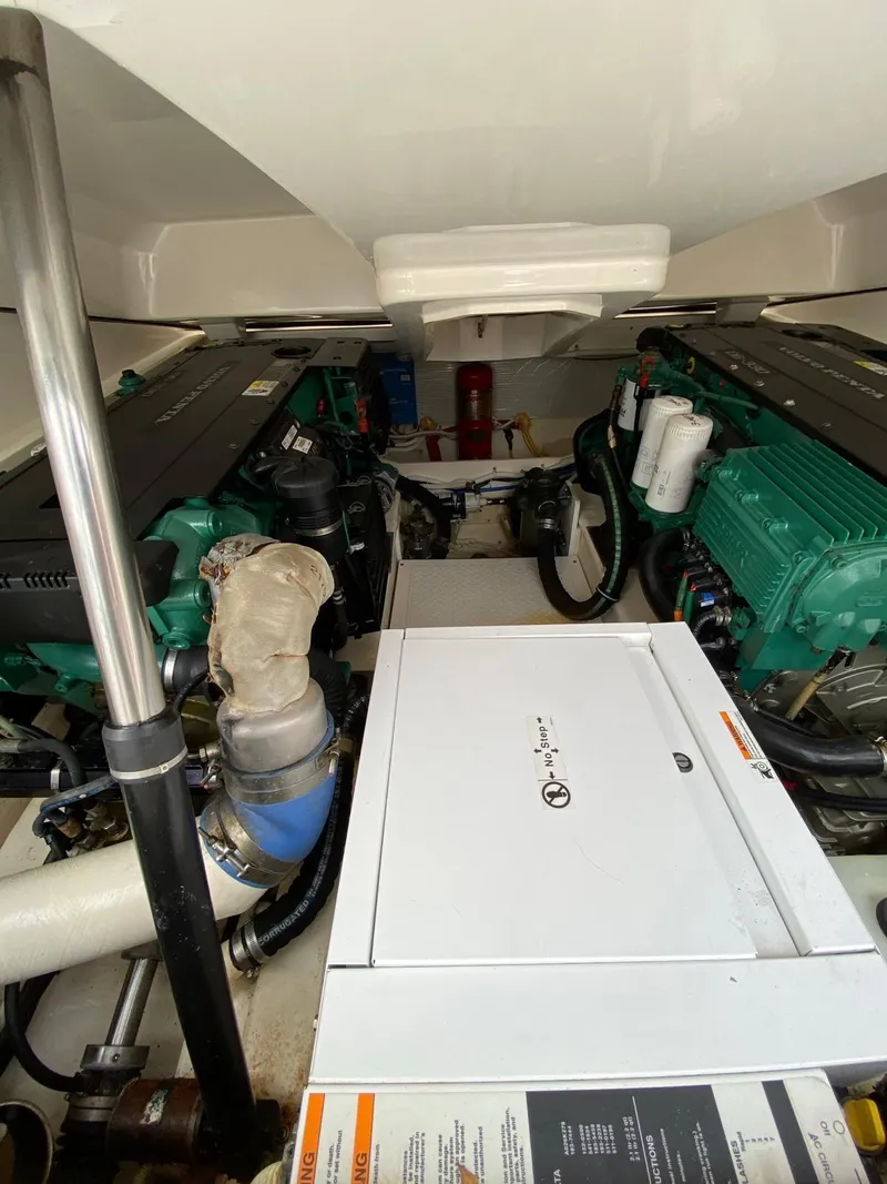 Slide: The Image of Engine room of 2015 Tiara Yachts 3100 Coronet with dual engines and mechanical components. - 15