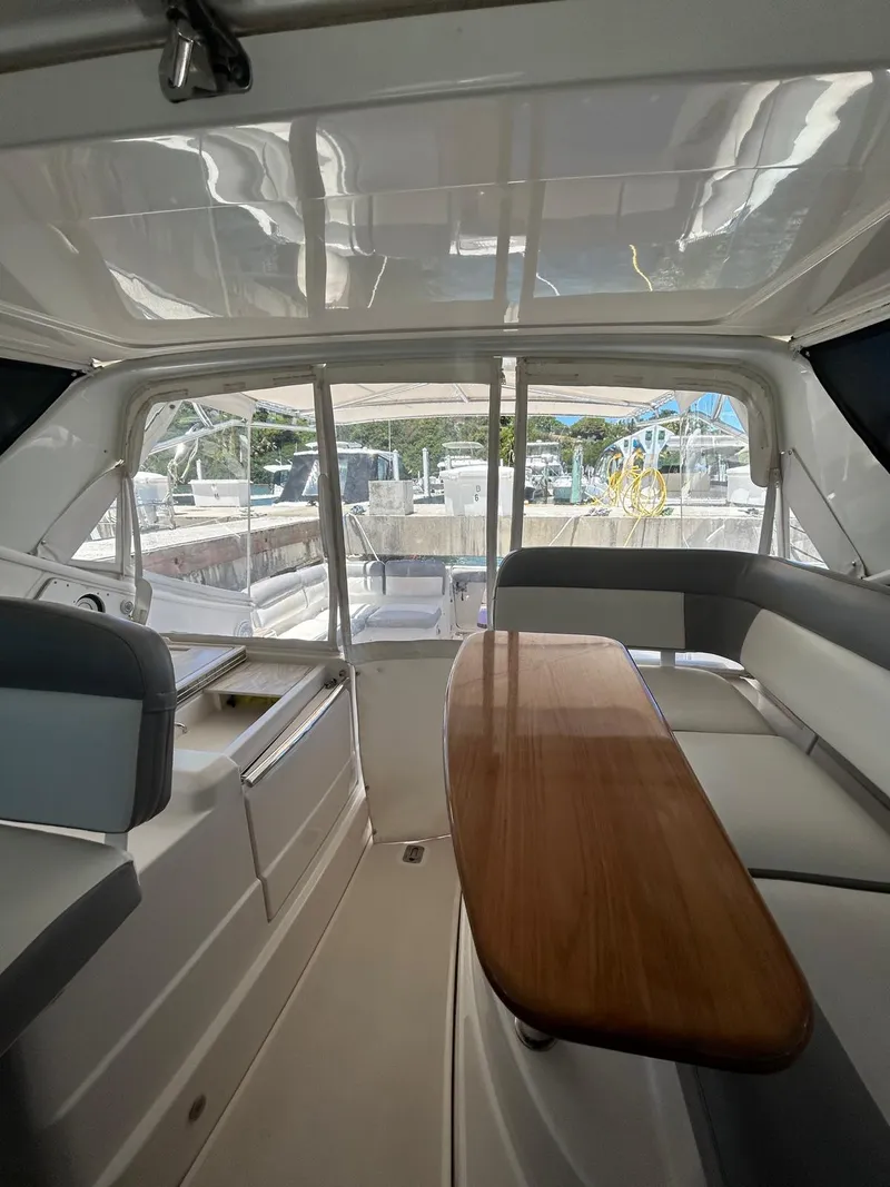 Slide: The Image of Interior of 2015 Tiara Yachts 3100 Coronet with seating and table. - 7