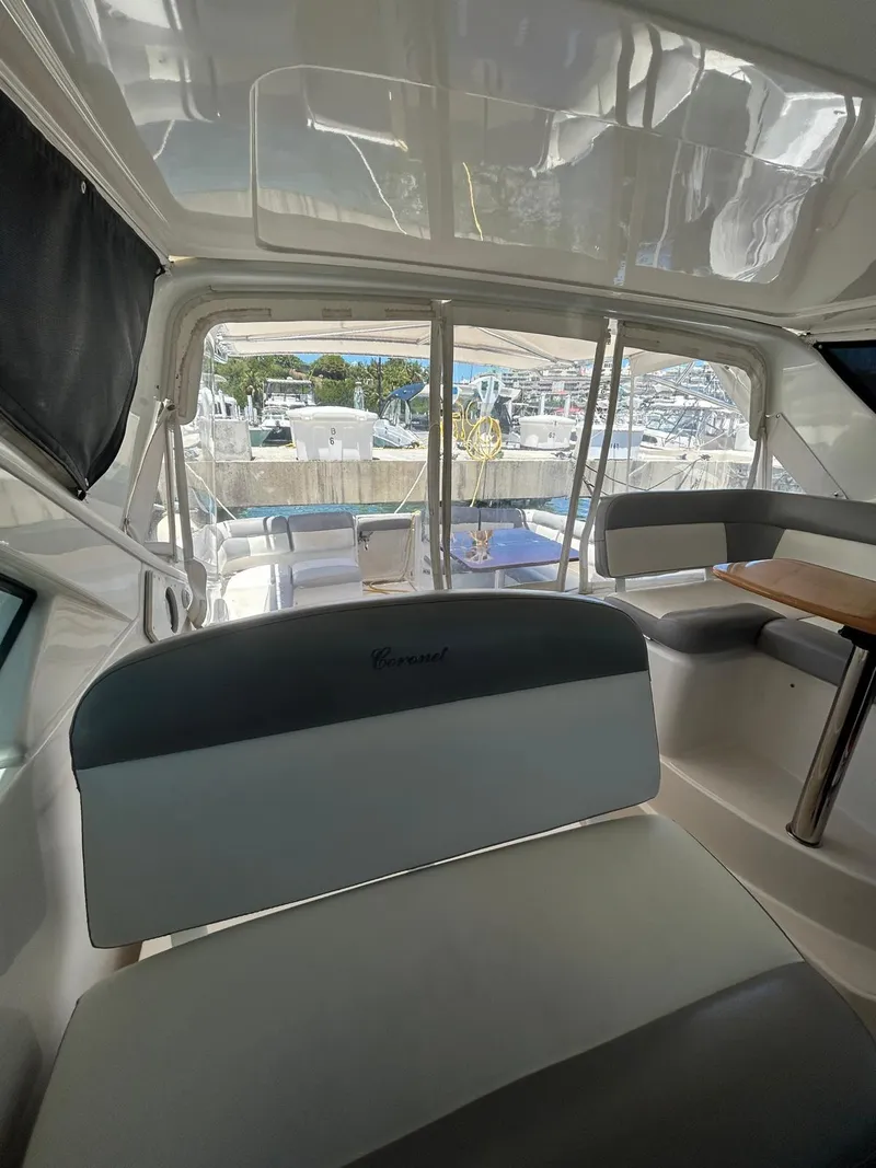 Slide: The Image of Interior view of 2015 Tiara Yachts 3100 Coronet, featuring seating and table. - 8