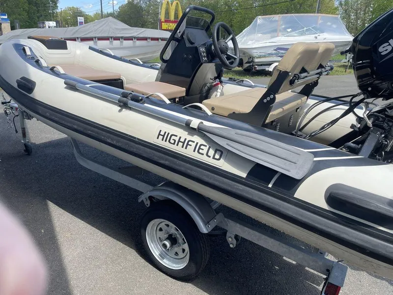 Slide: The Image of 2023 Highfield Classic 380 GT Limited boat on trailer, outdoor display. - 10