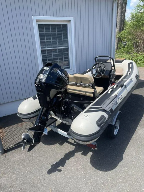 Slide: The Image of 2023 Highfield Classic 380 GT Limited inflatable boat with Suzuki outboard motor on trailer. - 3