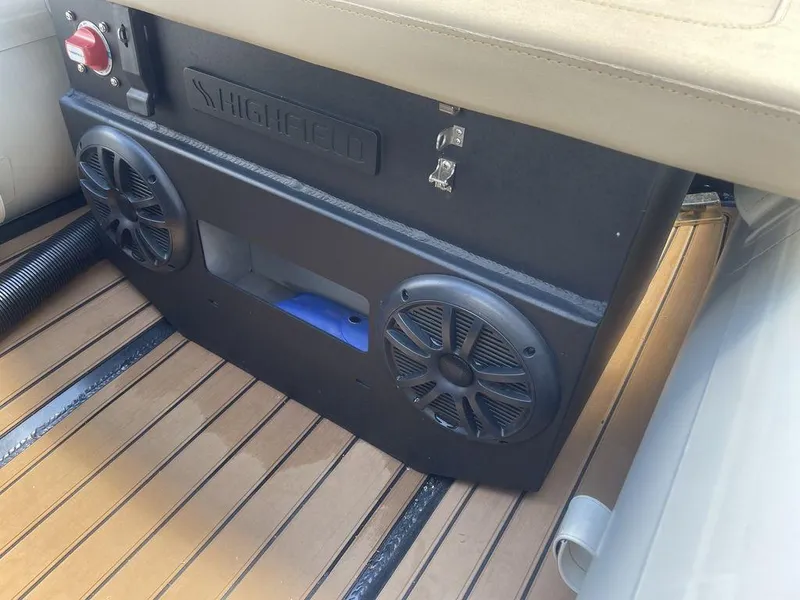 Slide: The Image of 2023 Highfield Classic 380 GT Limited boat interior with speakers and teak flooring. - 5