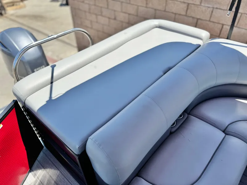 Slide: The Image of 2019 Manitou 23 Oasis boat with gray seating and sleek design. - 18