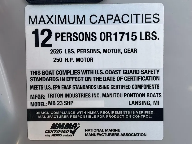 Slide: The Image of 2019 Manitou 23 Oasis capacity label: 12 persons or 1715 lbs, 250 HP motor, NMMA certified. - 29