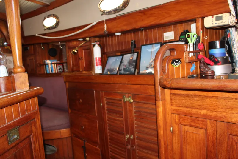 Slide: The Image of Interior of 1979 Hans Christian 38 Ketch with wooden cabinetry and nautical decor. - 12
