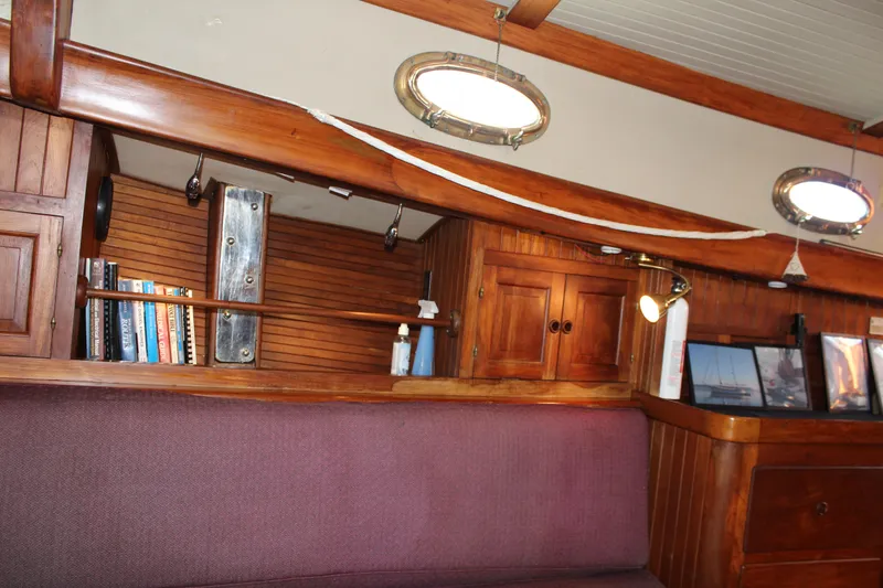 Slide: The Image of 1979 Hans Christian 38 Ketch interior with wooden cabinetry and cozy seating area. - 22