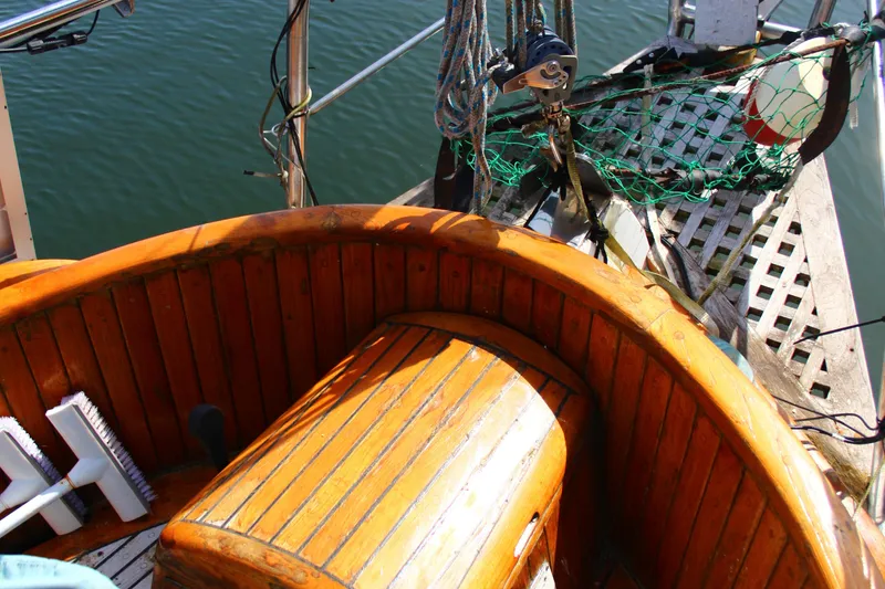 Slide: The Image of 1979 Hans Christian 38 Ketch deck with wooden details and nautical equipment. - 24