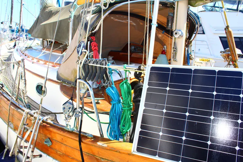 Slide: The Image of 1979 Hans Christian 38 Ketch sailboat with solar panel and colorful ropes on deck. - 26