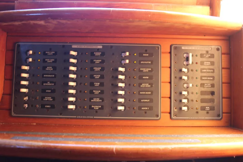 Slide: The Image of Electrical panel on a 1979 Hans Christian 38 Ketch sailboat, featuring switches and labels. - 28