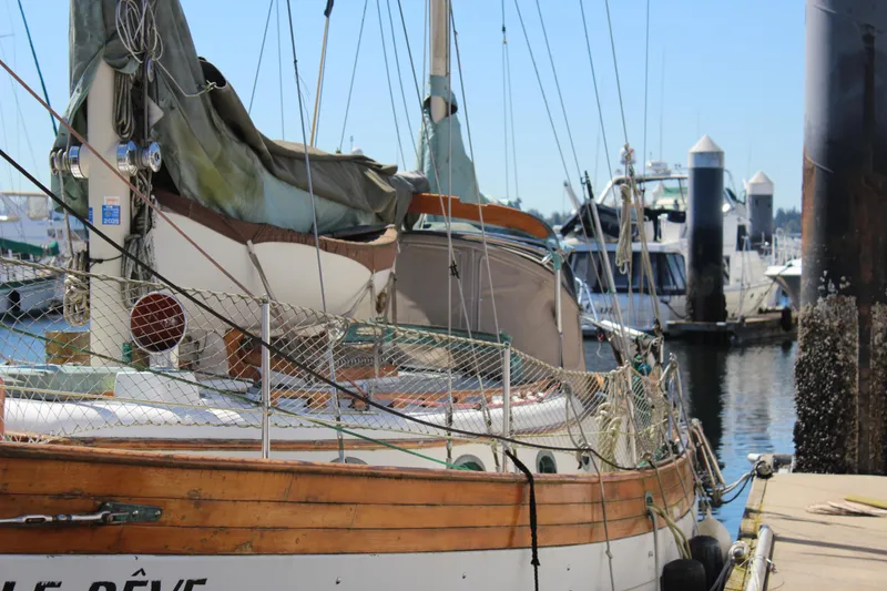 Slide: The Image of 1979 Hans Christian 38 Ketch sailboat docked at a marina, sunny day. - 3