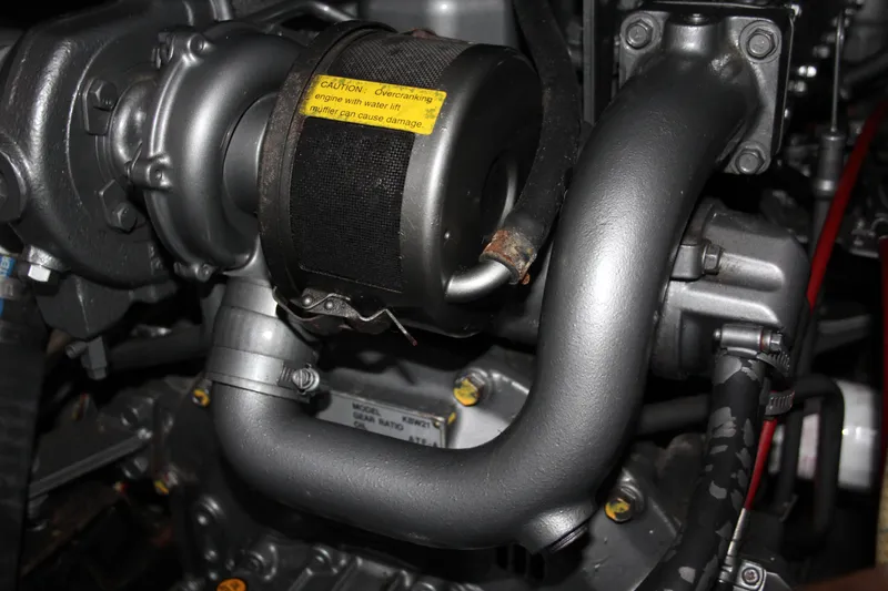 Slide: The Image of Close-up of a 1979 Hans Christian 38 Ketch engine component with visible turbocharger. - 30