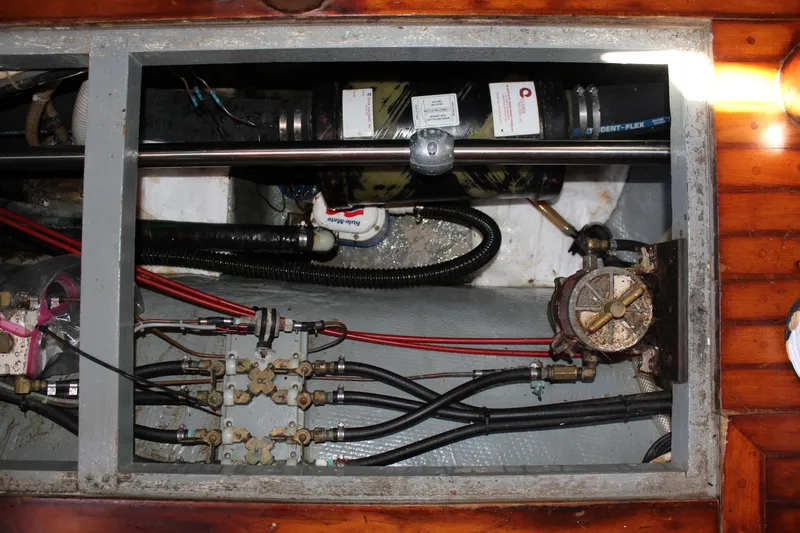 Slide: The Image of Engine compartment of 1979 Hans Christian 38 Ketch, showing mechanical components and wiring. - 31