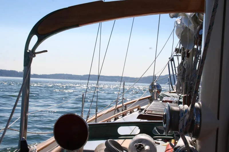 Slide: The Image of 1979 Hans Christian 38 Ketch sailing on a sunny day, with sparkling water and clear skies. - 34
