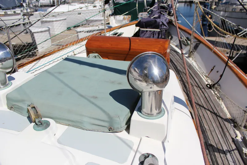 Slide: The Image of 1979 Hans Christian 38 Ketch deck with polished metal fittings and wooden accents. - 7