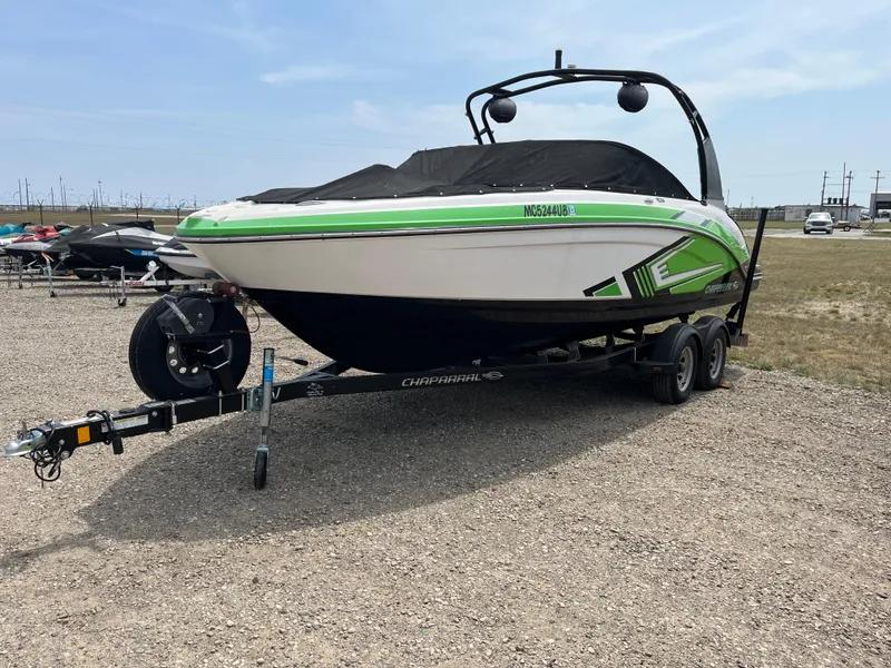 Slide: The Image of 2016 Chaparral Vortex 223 VRX boat on trailer, green and white design. - 1