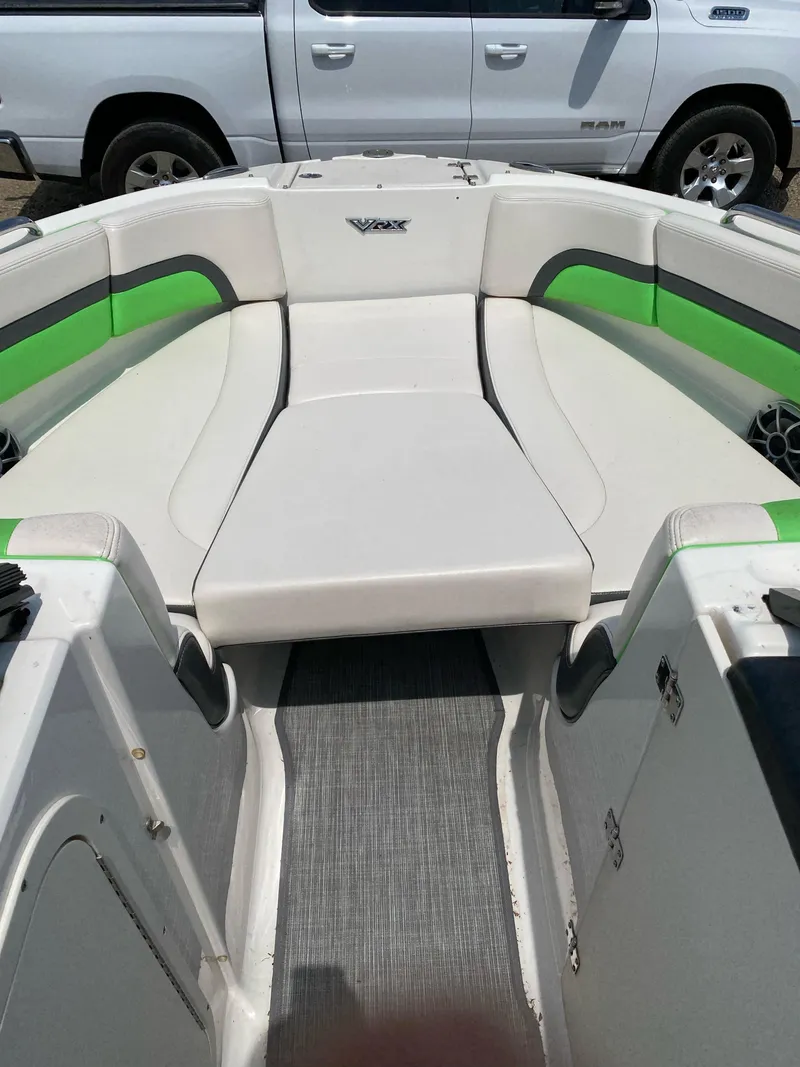 Slide: The Image of 2016 Chaparral Vortex 223 VRX boat interior with white and green seating. - 3