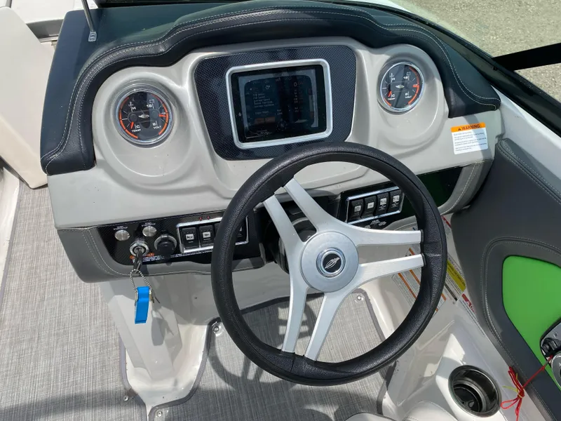 Slide: The Image of 2016 Chaparral Vortex 223 VRX dashboard with steering wheel and gauges. - 5