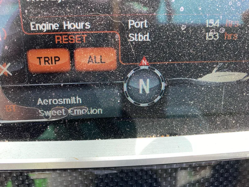 Slide: The Image of Display screen of 2016 Chaparral Vortex 223 VRX showing engine hours and music track. - 6