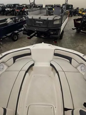 Slide: The Image of 2015 Yamaha AR210 boat interior with seating, displayed in a showroom. - 14