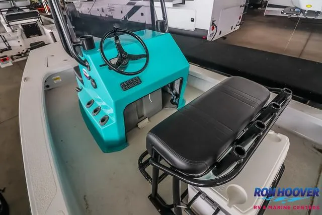 Slide: The Image of 2025 Majek 18 M2 boat interior with teal console and black seating at Ron Hoover Marine. - 15