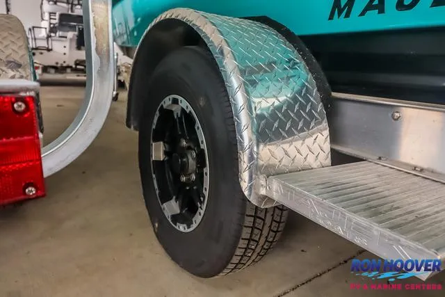 Slide: The Image of 2025 Majek 18 M2 boat trailer with diamond plate fender and black wheel. - 22